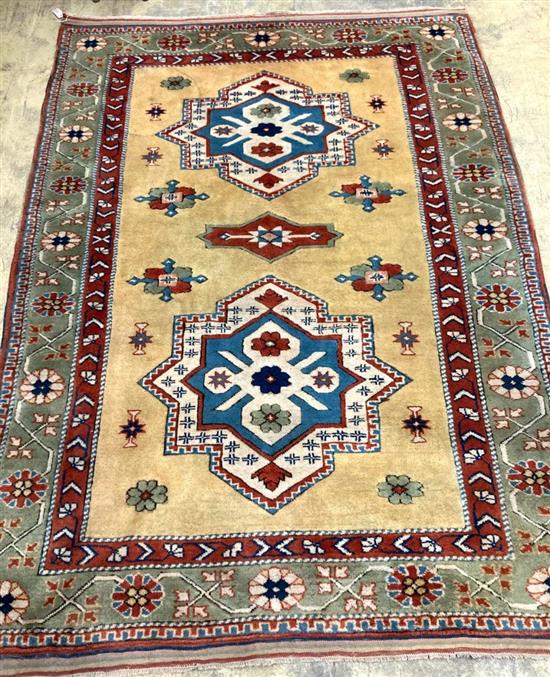 A Kazak yellow ground small carpet, 244 x 181cm